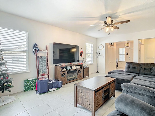 living room with ceiling fan and light tile patterned floors