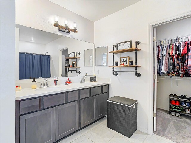 bathroom with tile patterned flooring and vanity