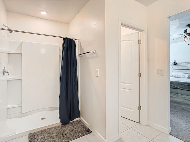 bathroom with tile patterned flooring, a shower with curtain, and ceiling fan