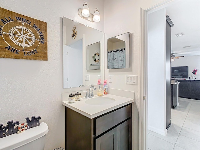 bathroom featuring tile patterned floors, ceiling fan, toilet, and vanity