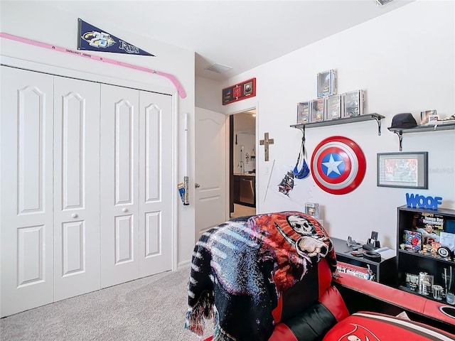 carpeted bedroom featuring a closet