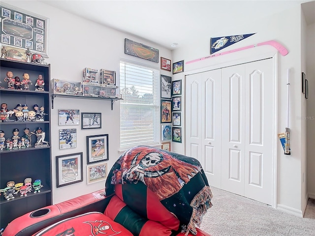 carpeted bedroom with a closet