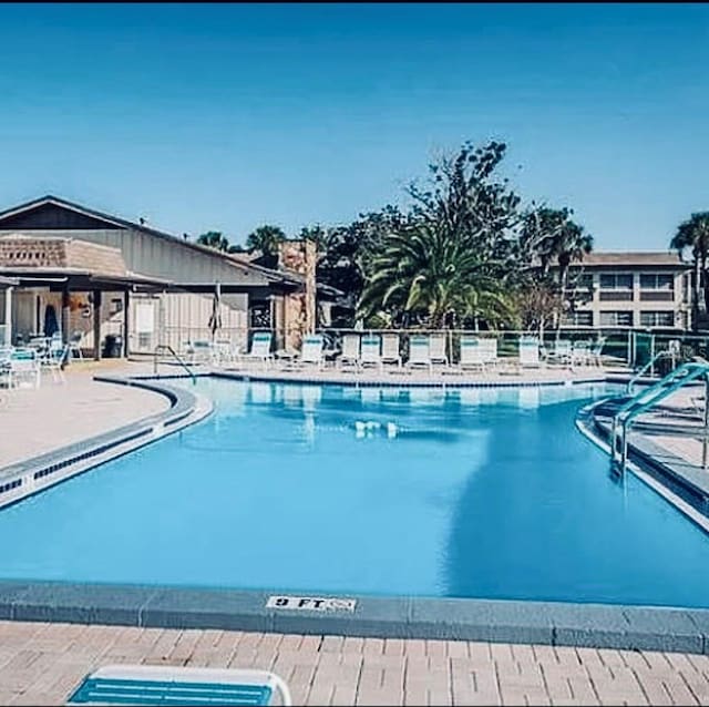 view of pool featuring a patio