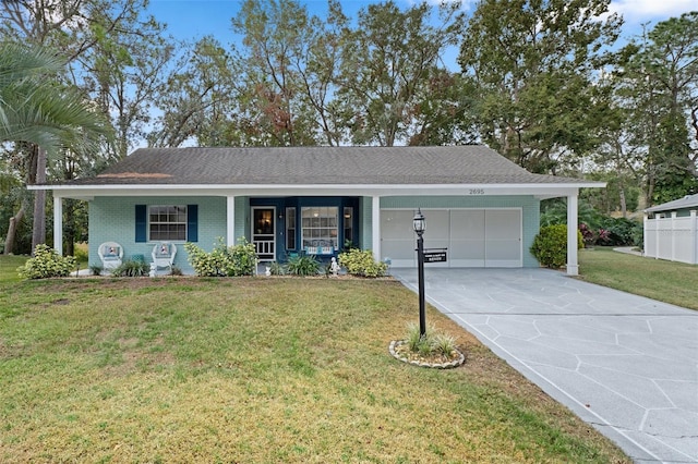 single story home with a porch, a garage, and a front lawn