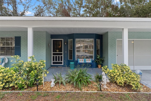 entrance to property with a porch