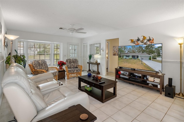 living room with light tile patterned floors and ceiling fan