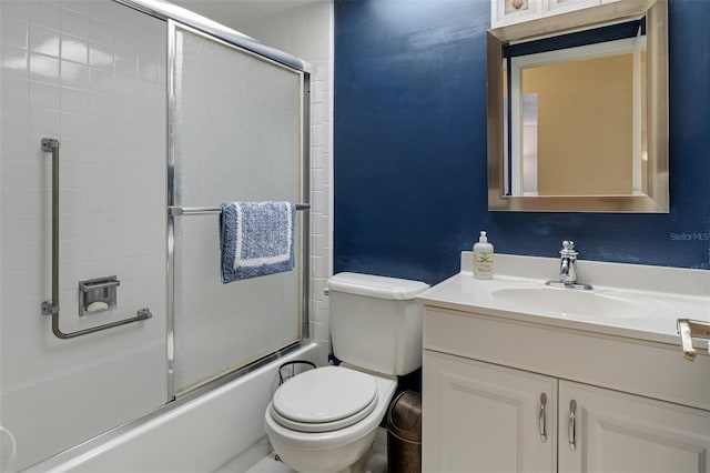 full bathroom featuring vanity, toilet, and enclosed tub / shower combo