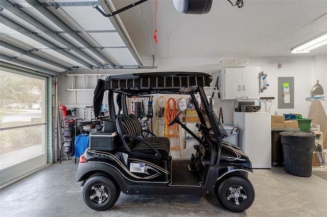 garage with electric panel and a garage door opener