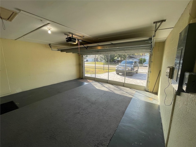 garage featuring a garage door opener