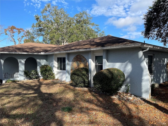 view of home's exterior with a lawn