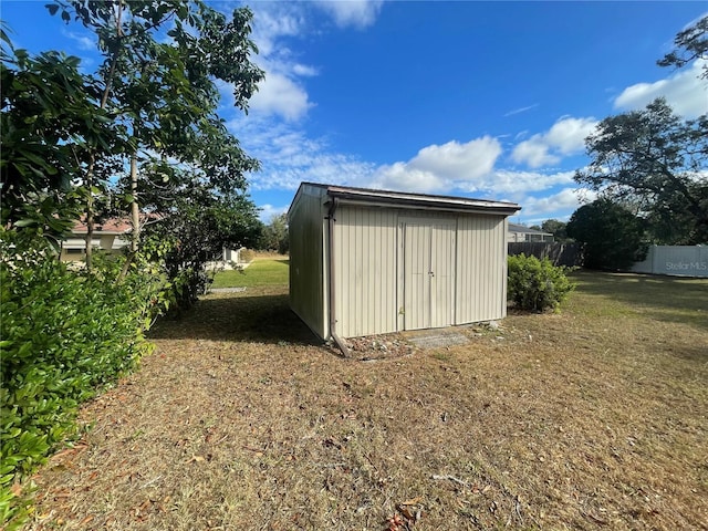 view of outdoor structure featuring a yard