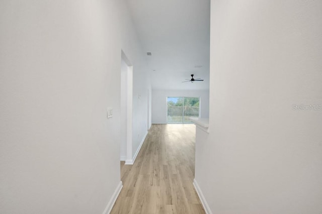 hall with light hardwood / wood-style floors