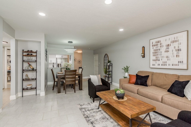 living room with a textured ceiling