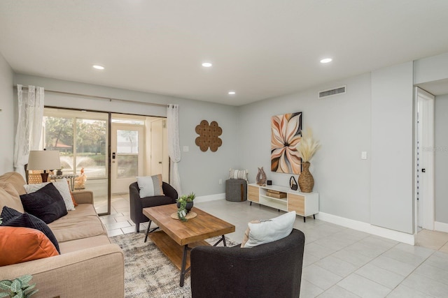 tiled living room featuring french doors