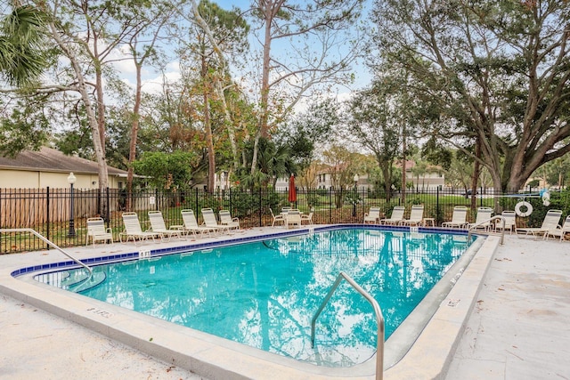 view of swimming pool with a patio area