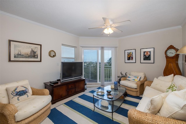 living room with ceiling fan and ornamental molding