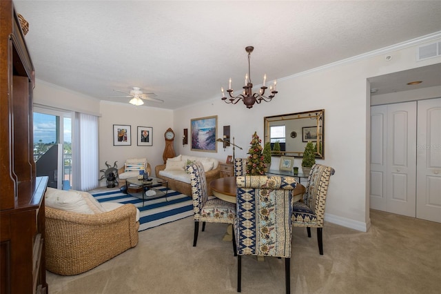 dining area featuring light colored carpet, ornamental molding, and a textured ceiling