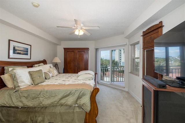 carpeted bedroom featuring ceiling fan, a textured ceiling, and access to outside