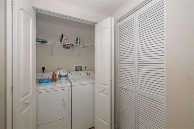 washroom with washer and clothes dryer