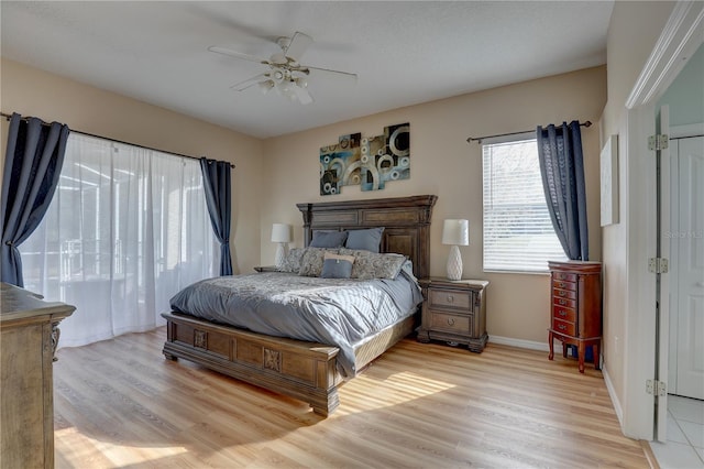 bedroom featuring ceiling fan and light hardwood / wood-style floors