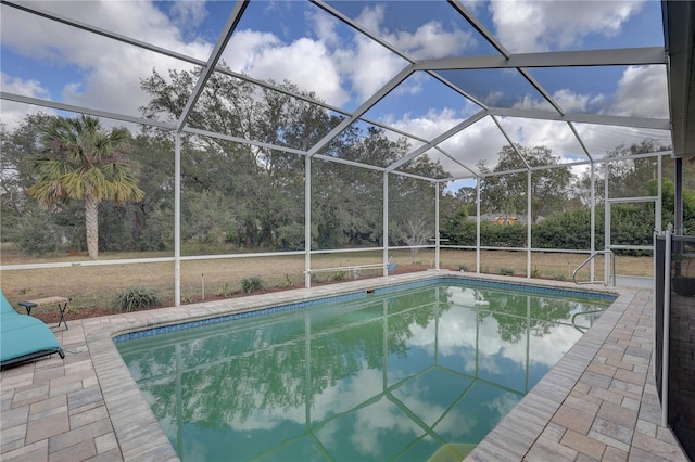 view of pool featuring a patio area and a lanai