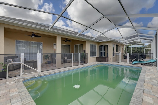 view of pool featuring ceiling fan, a lanai, and a patio