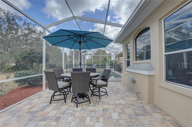 view of patio / terrace with a lanai