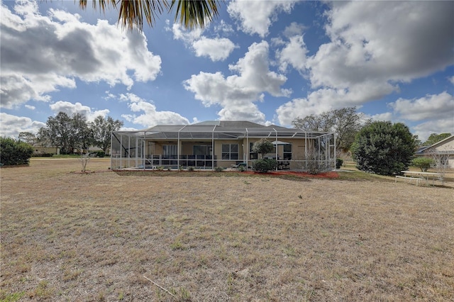 rear view of property featuring a lanai