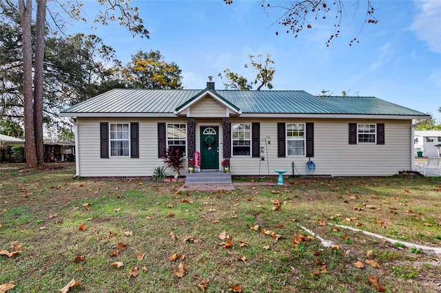 single story home featuring a front lawn