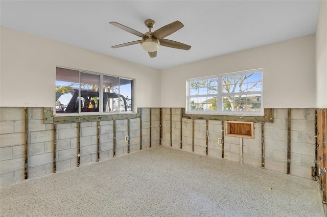 basement with ceiling fan