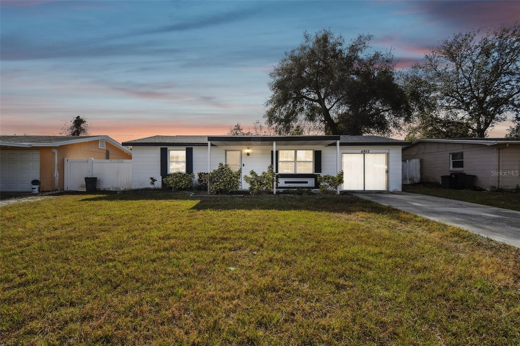 ranch-style house featuring a yard