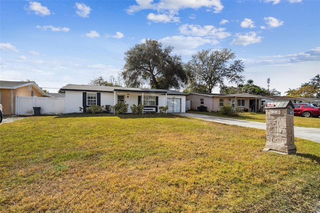 single story home with a porch and a front lawn