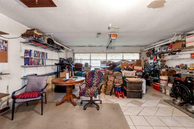 garage featuring a workshop area and a garage door opener