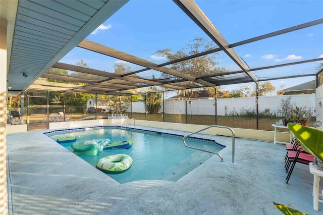 view of swimming pool with a patio and a lanai