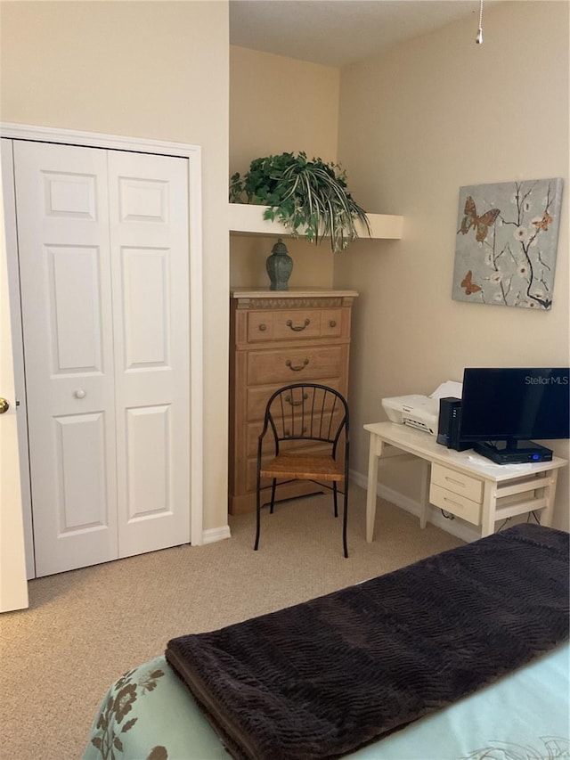 carpeted bedroom with a closet