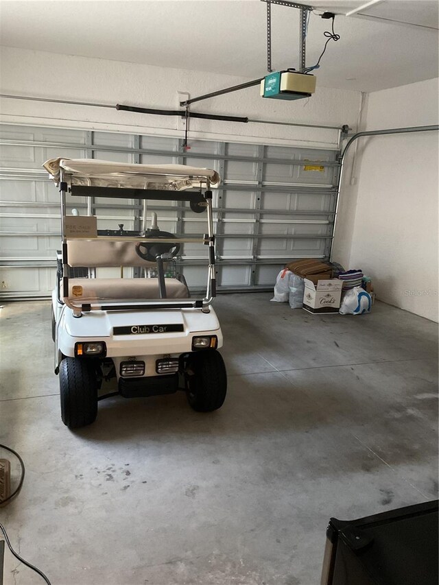 garage featuring a garage door opener