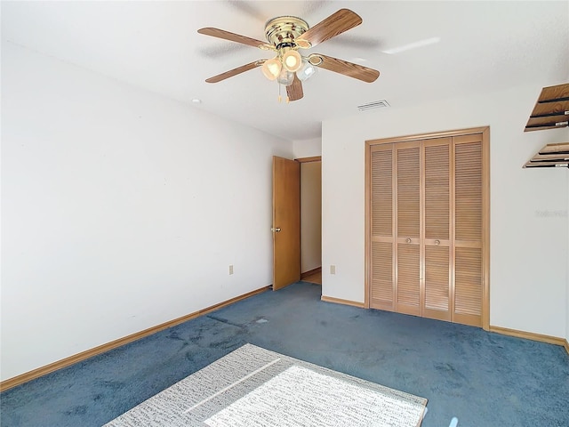 unfurnished bedroom featuring carpet floors, a closet, and ceiling fan