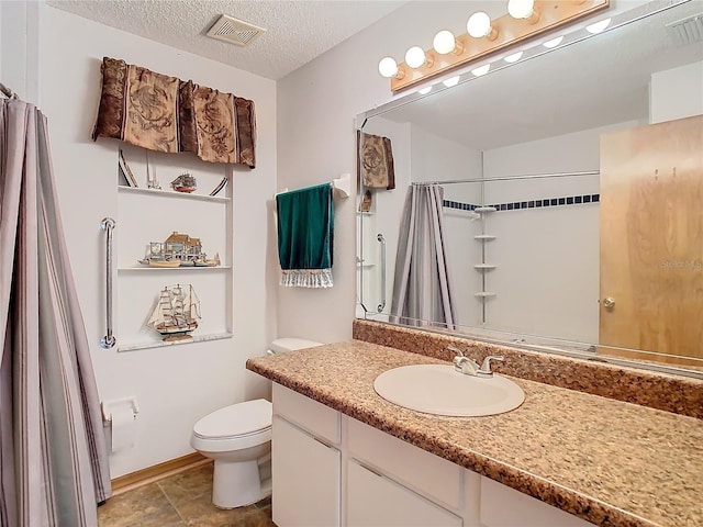 bathroom featuring a shower with curtain, tile patterned flooring, a textured ceiling, toilet, and vanity