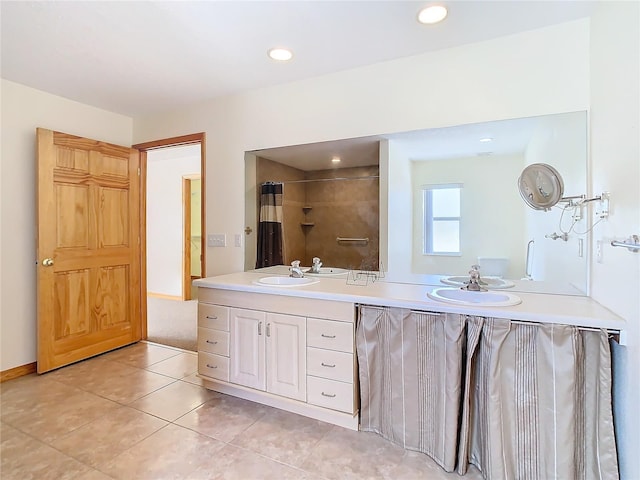 bathroom featuring tile patterned floors and vanity