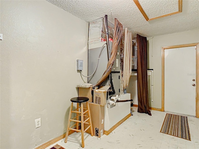 interior space featuring a textured ceiling