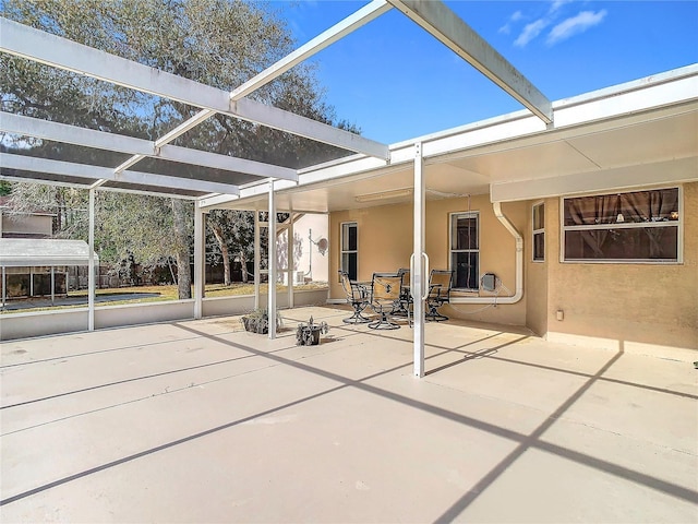 view of patio / terrace featuring a lanai