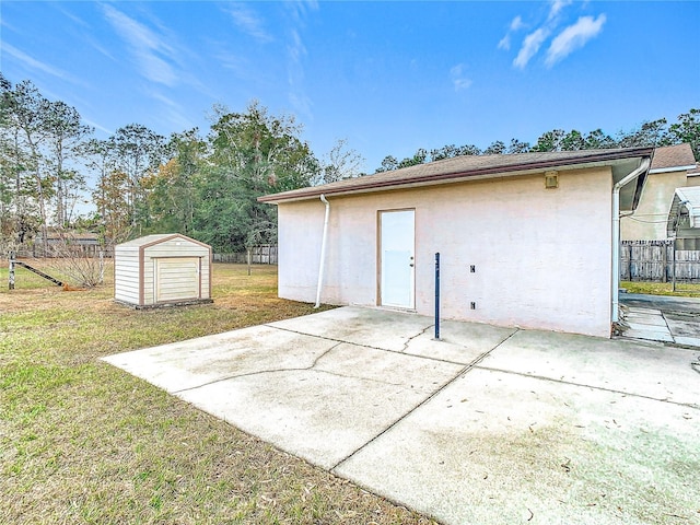 view of outbuilding featuring a lawn