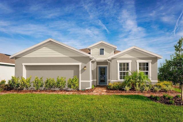 view of front facade featuring a front lawn and a garage