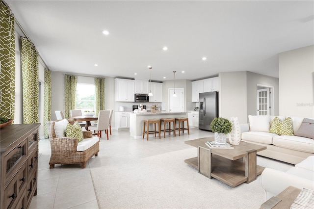 living room featuring light tile patterned flooring