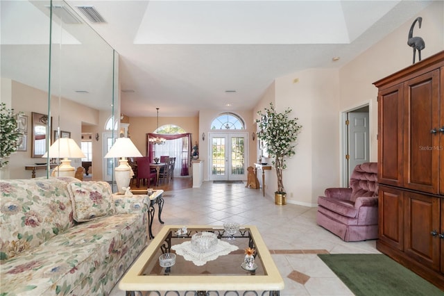 living room featuring light tile patterned flooring and french doors