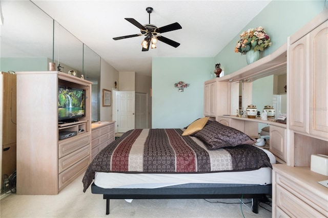 bedroom featuring light carpet and ceiling fan