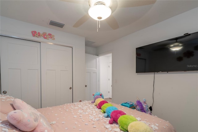 bedroom featuring ceiling fan and a closet