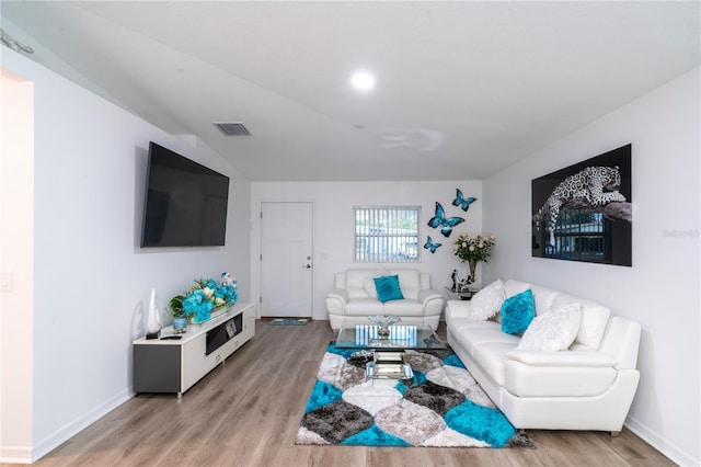 living room with light hardwood / wood-style floors