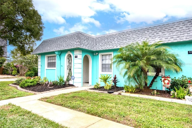 view of front of home with a front lawn