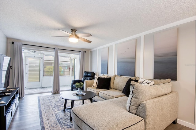 4209 Prince Pl Unit A, New Port Richey, FL 34652 - living area featuring wood finished floors, a textured ceiling, and ceiling fan